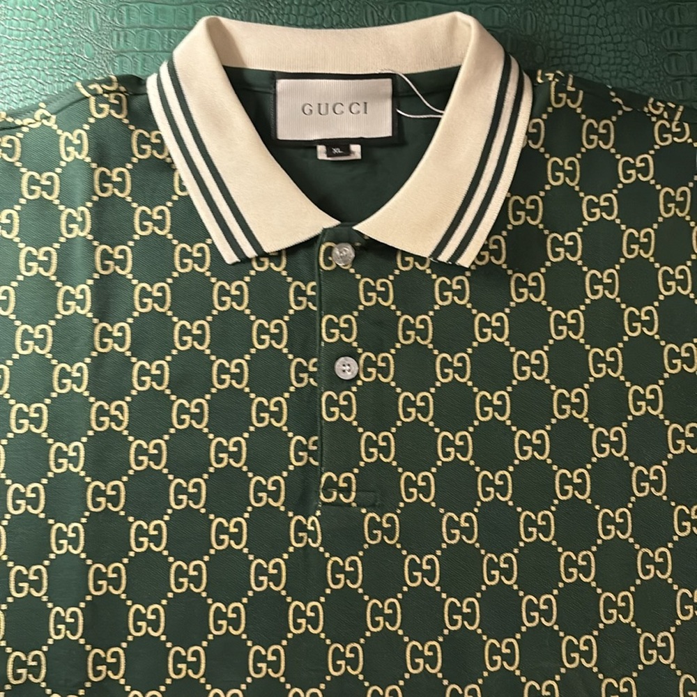 Gucci dark green polo with ivory collar and Guccisima interlocking GG pattern